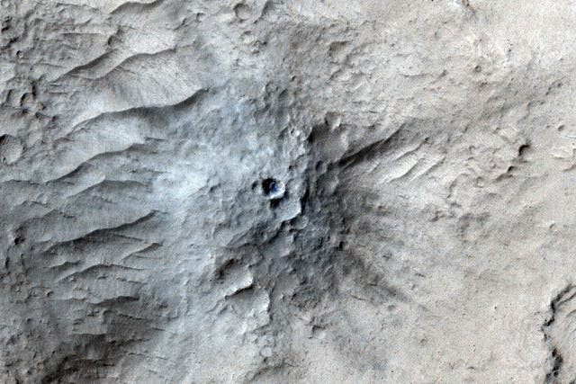 <p>Captured by the HiRISE camera on NASA’s Mars Reconnaissance Orbiter in March 2021, this impact crater was found in the Cerberus Fossae region of Mars. Scientists matched its appearance on the surface with a quake detected by NASA’s InSight lander</p>