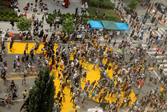 <p>Demonstrators gather at Black Lives Matter Plaza near the White House during a protest against racial inequality in the aftermath of the death of George Floyd in 2020 in Minneapolis police custody</p>