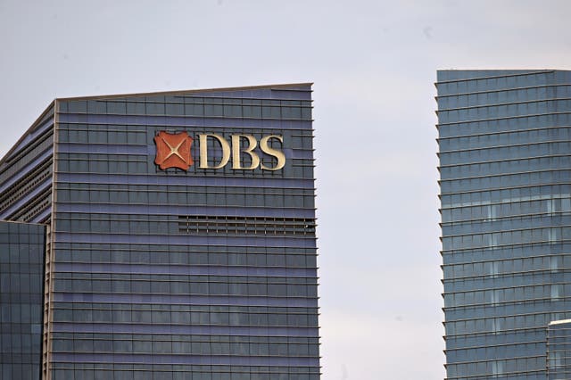 <p>A DBS logo is displayed on a building in Singapore</p>