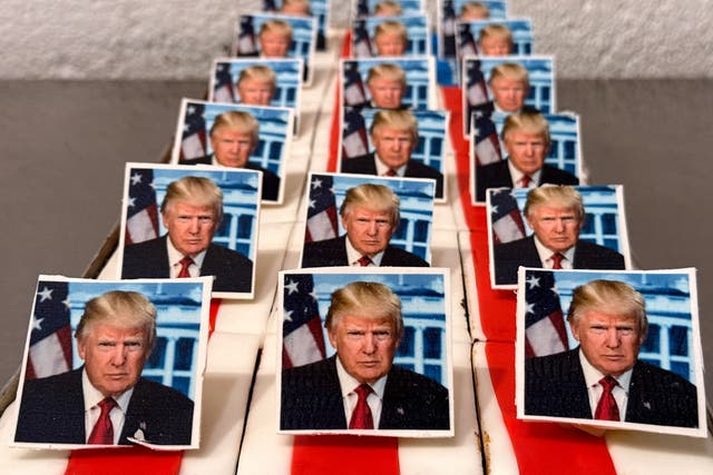 <p>Pastries decorated with an edible picture of Trump are presented at a bakery in Freinsheim, Germany to mark his second inauguration</p>