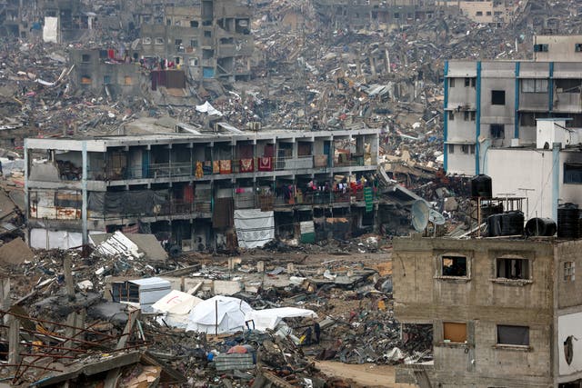 <p>People camp in a heavily damaged UN school surrounded by destruction, as displaced Palestinians return to the northern areas of the Gaza Strip, in Jabalia, on 23 January 2025, during a ceasefire in the war between Israel and Hamas. In the war-battered Gaza Strip, displaced Palestinians set off on foot or by car to return home as trucks loaded with sorely needed humanitarian aid funnelled into the devastated territory. The truce mediated by Qatar, Egypt and the United States began on 19 January on the eve of Donald Trump’s inauguration for a second term as US president</p>