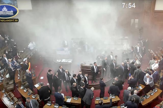 <p>Smoke grenades were set off in Serbian parliament on Tuesday</p>