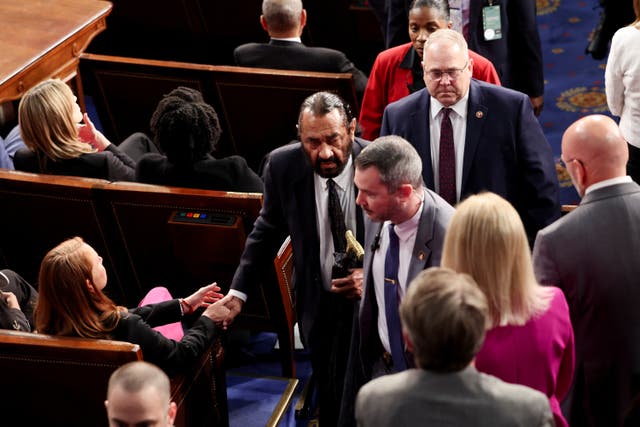 <p>U.S. Rep. Al Green (D-TX) is escorted out after shouting during U.S. President Donald Trump's speech to a joint session of Congress, in the House Chamber of the U.S. Capitol in Washington, D.C., U.S., March 4, 2025</p>