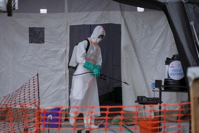 <p>A medical worker disinfects a tent used for suspected Ebola victims inside the Ebola isolation center of Madudu Health Center III, Uganda (file photo)</p>