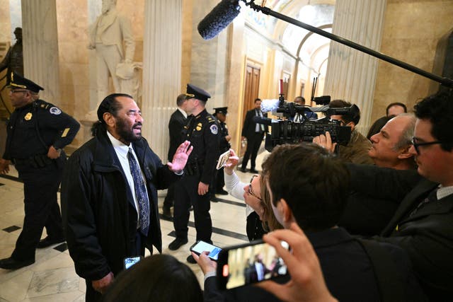 <p>US Representative Al Green (D-TX) speaks to reporters after being removed from the chamber after shouting out as US President Donald Trump delivered his address to a joint session of Congress in the House Chamber of the US Capitol in Washington, DC, on March 4, 2025</p>