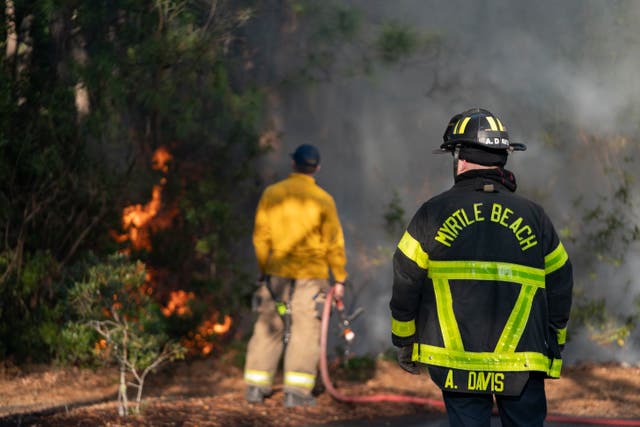 <p>Firefighters continue to battle the Carolina Forest near Myrtle Beach in South Carolina as it engulfs more than 2,000 acres </p>